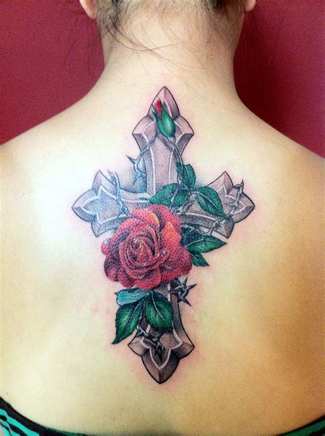 female rose and cross tattoo